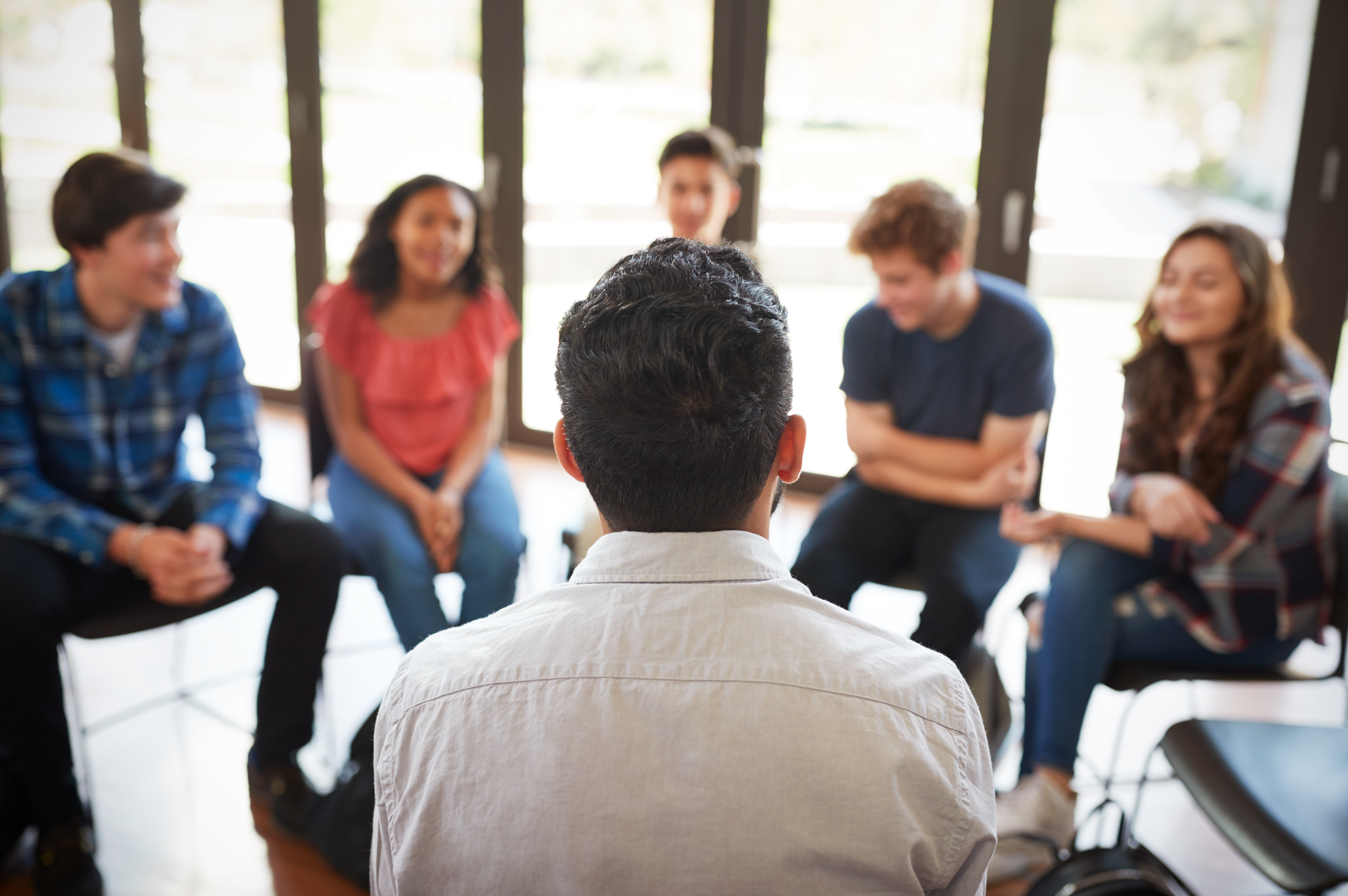 young-adults-sitting-circle.jpg